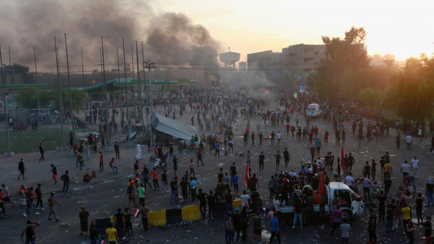 Demonstrators gather at a protest during a curfew, two days after the nationwide anti-government protests turned violent, in Baghdad, Iraq October 3, 2019. REUTERS/Alaa al-Marjani - RC17F2432F10