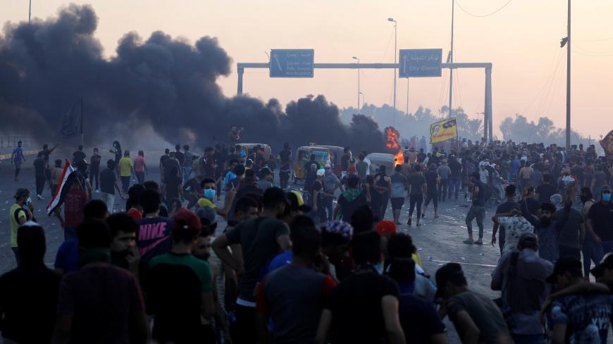 Demonstrators gather at a protest after the lifting of the curfew, following four days of nationwide anti-government protests that turned violent, in Baghdad, Iraq October 5, 2019. REUTERS/Thaier Al-Sudani - RC1144979C00