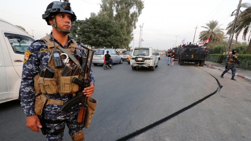 A member of Iraqi federal police stands guard in a street in Baghdad, Iraq October 7, 2019.  REUTERS/Wissm al-Okili - RC160EF8FEE0