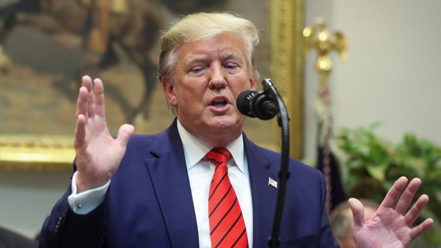 U.S. President Donald Trump answers questions from reporters during an event to sign executive orders on "transparency in federal guidance and enforcement" in the Roosevelt Room of the White House in Washington, U.S., October 9, 2019. REUTERS/Jonathan Ernst - RC1D0C443790