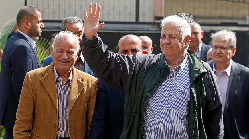 Chairman of the Palestinian Central Election Committee Hana Naser waves after his arrival in Gaza City October 28, 2019. REUTERS/Mohammed Salem - RC1B59B02880
