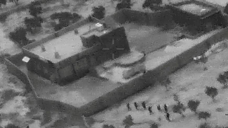 U.S. special forces move towards the compound of Islamic State leader Abu Bakr al-Baghdadi during a raid in the Idlib region of Syria in a still image from video October 26, 2019. Video picture taken October 26, 2019. U.S. Department of Defense/Handout via REUTERS. THIS IMAGE HAS BEEN SUPPLIED BY A THIRD PARTY. TPX IMAGES OF THE DAY - RC151E5EB540