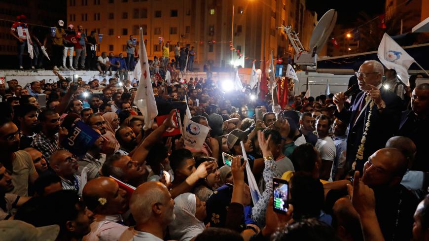 Rached Ghannouchi, leader of Tunisia's moderate Islamist Ennahda, speaks to supporters after the party gained most votes in Sunday's parliamentary election, according to an exit poll by Sigma Conseil broadcasted by state television, in Tunis, Tunisia October 6, 2019. REUTERS/Zoubeir Souissi - RC1AEA2A12F0