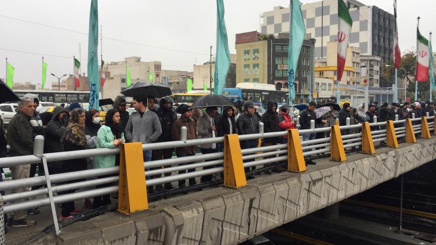 People stands in the street to show their protest against increased gas price in Tehran, Iran November 16, 2019. Nazanin Tabatabaee/WANA (West Asia News Agency) via REUTERS ATTENTION EDITORS - THIS IMAGE HAS BEEN SUPPLIED BY A THIRD PARTY - RC2BCD9CNWMV