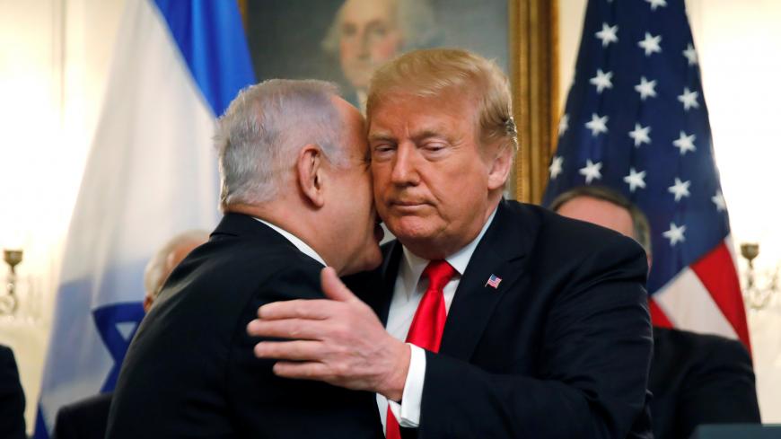 Israel's Prime Minister Benjamin Netanyahu hugs U.S. President Donald Trump as they talk during meetings at the White House in Washington, U.S., March 25, 2019. REUTERS/Carlos Barria - RC15FD644460