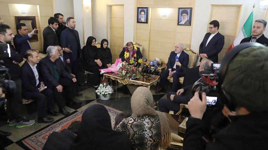 Iranian professor Massoud Soleimani is seen next to Iran's Foreign Minister Mohammad Javad Zarif during his arrival at Mehrabad airport, in Tehran, Iran December 7, 2019. Picture taken December 7, 2019. West Asia News Agency (WANA) via REUTERS ATTENTION EDITORS - THIS IMAGE HAS BEEN SUPPLIED BY A THIRD PARTY - RC2VQD9YNUU9