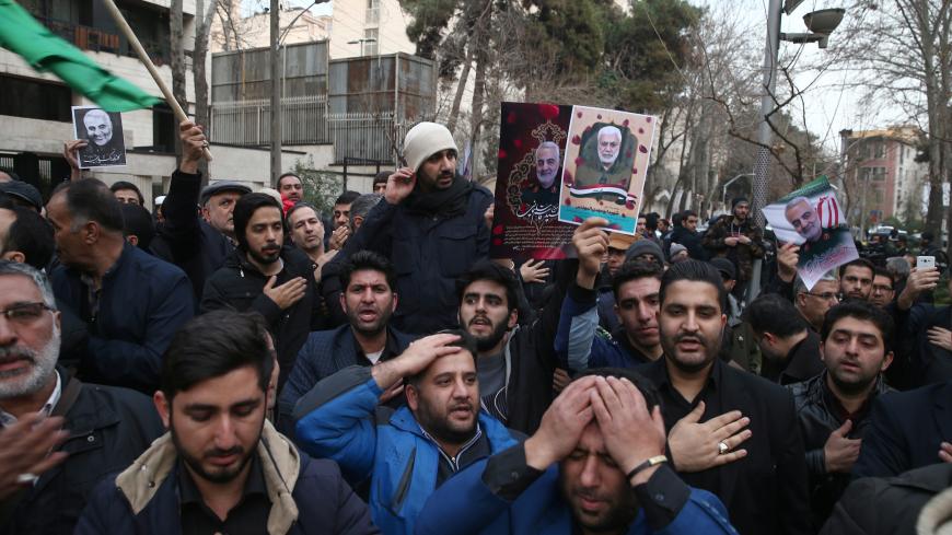 Iranian demonstrators react during a protest against the assassination of the Iranian Major-General Qassem Soleimani, head of the elite Quds Force, and Iraqi militia commander Abu Mahdi al-Muhandis, who were killed in an air strike at Baghdad airport, in front of United Nation office in Tehran, Iran January 3, 2020. WANA (West Asia News Agency)/Nazanin Tabatabaee via REUTERS ATTENTION EDITORS - THIS IMAGE HAS BEEN SUPPLIED BY A THIRD PARTY. - RC2G8E9QWFRM