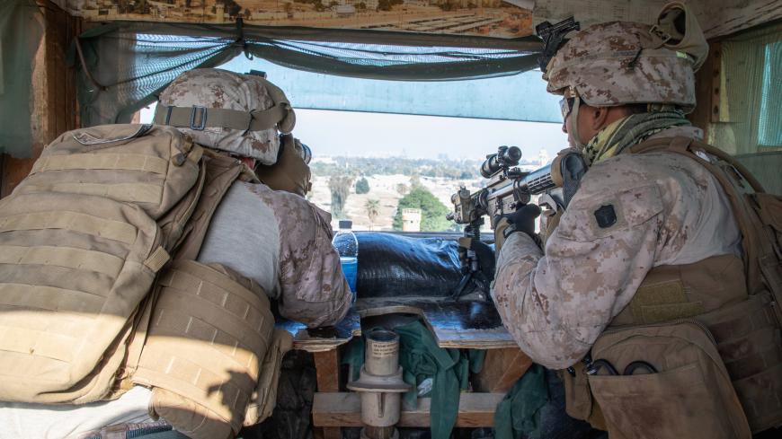 U.S. Marines with 2nd Battalion, 7th Marines, assigned to the Special Purpose Marine Air-Ground Task Force-Crisis Response-Central Command (SPMAGTF-CR-CC) 19.2, reinforce the U.S. embassy compound in Baghdad, Iraq, January 3, 2020. U.S. Marine Corps/Sgt. Kyle C. Talbot/Handout via REUTERS. ATTENTION EDITORS - THIS IMAGE HAS BEEN SUPPLIED BY A THIRD PARTY. - RC2H8E91F118