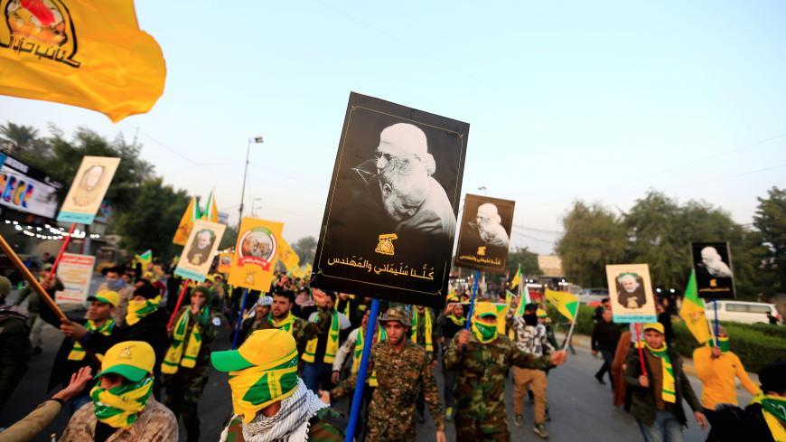 Kataib Hezbollah Iraqi militia gather ahead of the funeral of the Iraqi militia commander Abu Mahdi al-Muhandis, who was killed in an air strike at Baghdad airport, in Baghdad, Iraq, January 4, 2020. REUTERS/Thaier al-Sudani - RC2V8E9HPESK