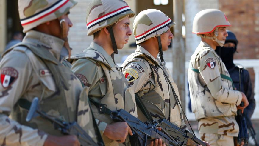 Military forces are seen in North Sinai, Egypt, December 1, 2017. Picture taken December 1, 2017. REUTERS/Mohamed Abd El Ghany - RC1333348CD0