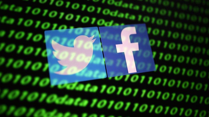 The Twitter and Facebook logo along with binary cyber codes are seen in this illustration taken November 26, 2019. REUTERS/Dado Ruvic/Illustration - RC20JD9NJO9K