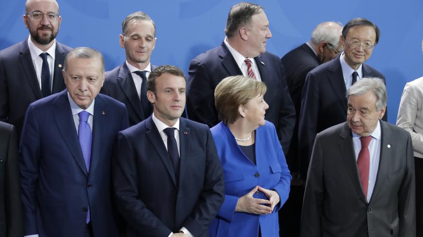 BERLIN, GERMANY - JANUARY 19, 2020: Turkeys President Recep Tayyip Erdogan, Frances President Emmanuel Macron, Germanys Chancellor Angela Merkel, UN Secretary General Antonio Guterres (L-R front), and US Secretary General Mike Pompeo (3rd L back) pose for a group photograph during a photo session at an international summit on Libya; the summit is to discuss efforts to achieve peace and reconciliation between Libya's government and General Haftar. Mikhail Metzel/TASS (Photo by Mikhail Metzel\TASS via Getty I