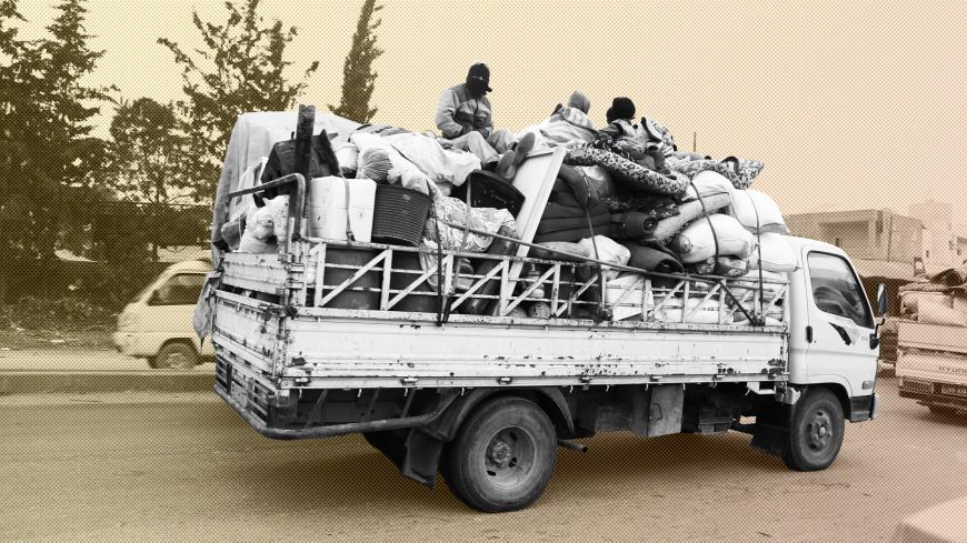 Trucks carry belongings of people fleeing from Maarat al-Numan, in northern Idlib, Syria December 24, 2019. REUTERS/Mahmoud Hassano - RC2U1E91IDWY