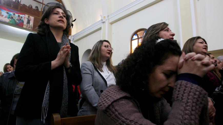 Iraqi Christians pray during a mass on Christmas Day at St. George Chaldean Church in Baghdad, Iraq December 25, 2019. REUTERS/Khalid al Mousily - RC292E9455EU
