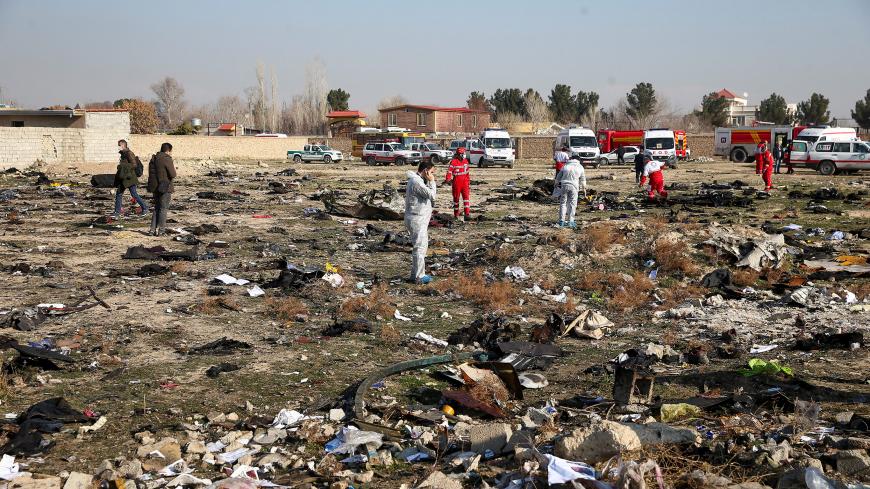 Rescue team works among debris of a plane belonging to Ukraine International Airlines, that crashed after take-off from Iran's Imam Khomeini airport, on the outskirts of Tehran, Iran January 8, 2020. Nazanin Tabatabaee/WANA (West Asia News Agency) via REUTERS ATTENTION EDITORS - THIS IMAGE HAS BEEN SUPPLIED BY A THIRD PARTY - RC2MBE9I2565