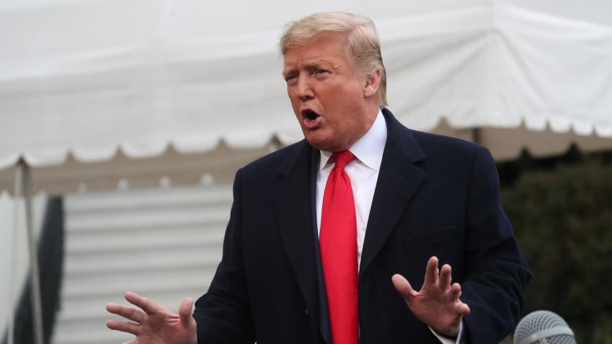 U.S. President Donald Trump speaks to reporters as he departs for travel to New Orleans, Louisiana from the South Lawn of the White House in Washington, U.S., January 13, 2020. REUTERS/Leah Millis - RC29FE97O1SV