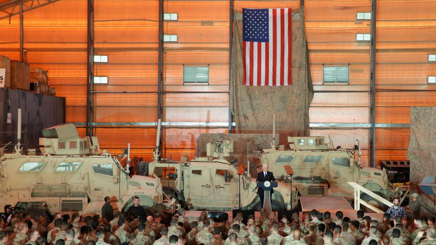 U.S. Vice President Mike Pence delivers remarks to U.S. troops at Al Asad Air Base, Iraq November 23, 2019. REUTERS/Jonathan Ernst - RC21HD9N30CL