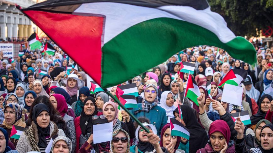 Moroccans wave the Palestinian flag during a demonstration against the US Middle East peace plan in the capital Rabat on February 9, 2020. - Morocco has warming but quiet relations with Israel, although they do not enjoy formal diplomatic ties. Israel and Morocco opened "liaison" offices in each other's countries in the mid-1990s but Rabat closed them after an escalation of Palestinian-Israeli violence in 2000. (Photo by FADEL SENNA / AFP) (Photo by FADEL SENNA/AFP via Getty Images)