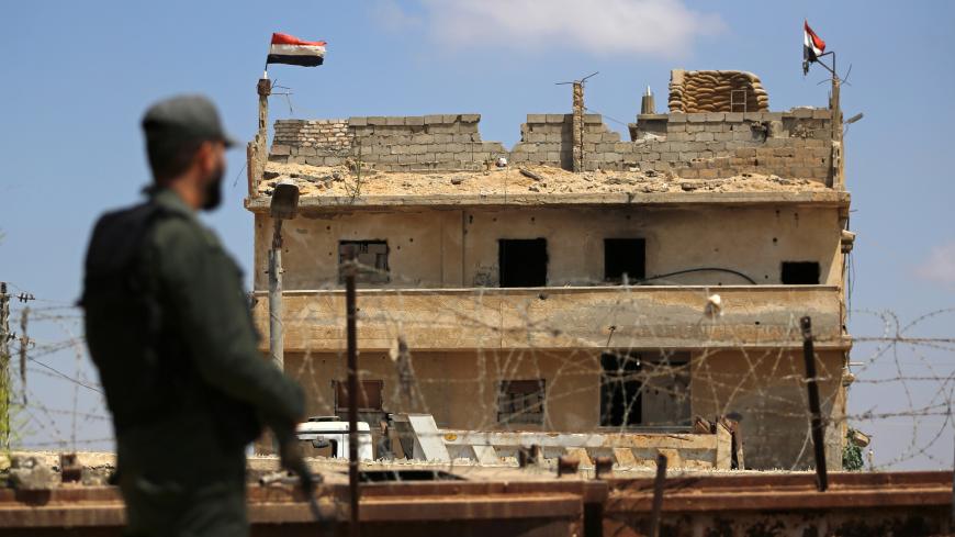 A member of Palestinian security forces, loyal to Hamas, stands guard at the border area with Egypt, in the southern Gaza Strip, June 23, 2019. Picture taken June 23, 2019. REUTERS/Ibraheem Abu Mustafa - RC1FA4398160