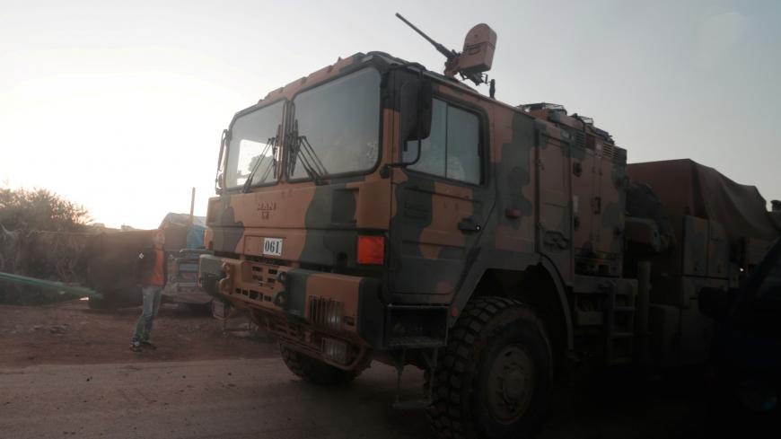 Turkish military vehicles enter the Bab al-Hawa crossing at the Syrian-Turkish border, in Idlib governorate, Syria, February 9, 2020. REUTERS/Khalil Ashawi - RC2AXE9G6YVS