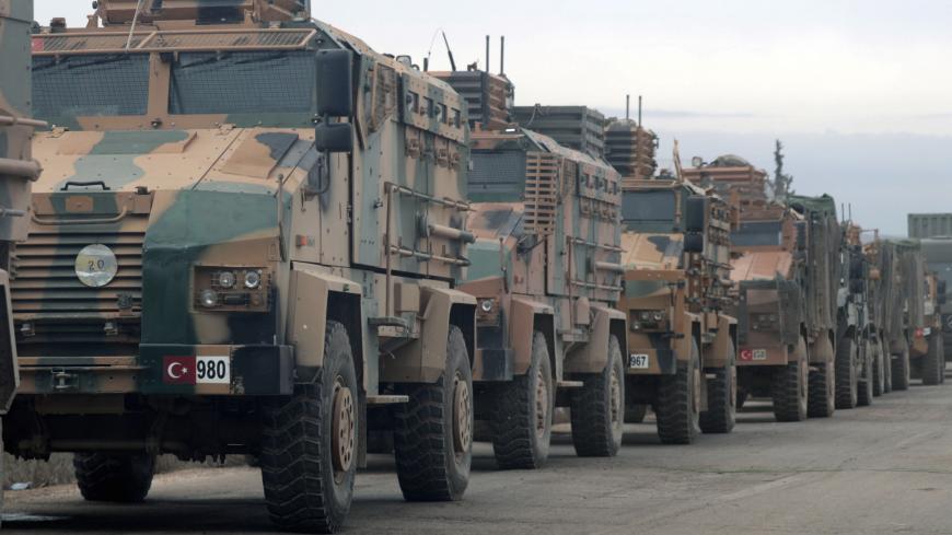 Turkish military vehicles are seen in Hazano near Idlib, Syria, February 11, 2020. REUTERS/Khalil Ashawi - RC2HYE9JOB3E