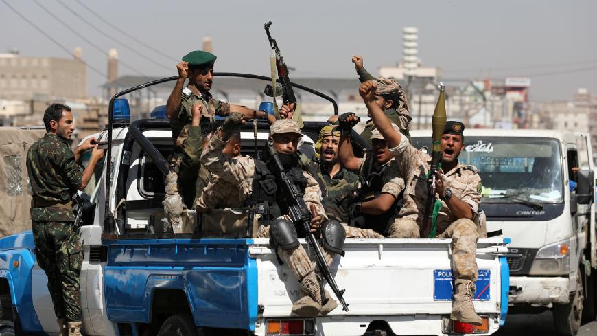 Houthi troops ride on the back of a police patrol truck after participating in a Houthi gathering in Sanaa, Yemen February 19, 2020. REUTERS/Khaled Abdullah - RC2M3F9S75BB