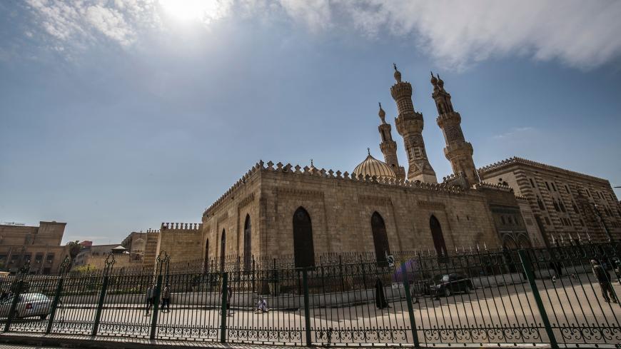 A few people walk in the vicinity of the closed Al-Azhar mosque in Egypt's capital Cairo on March 20, 2020, after the country's Muslim religious authorities decided to put the Friday prayers on hold, in order to avoid gatherings and the spread of the novel coronavirus COVID-19 disease. (Photo by Khaled DESOUKI / AFP) (Photo by KHALED DESOUKI/AFP via Getty Images)