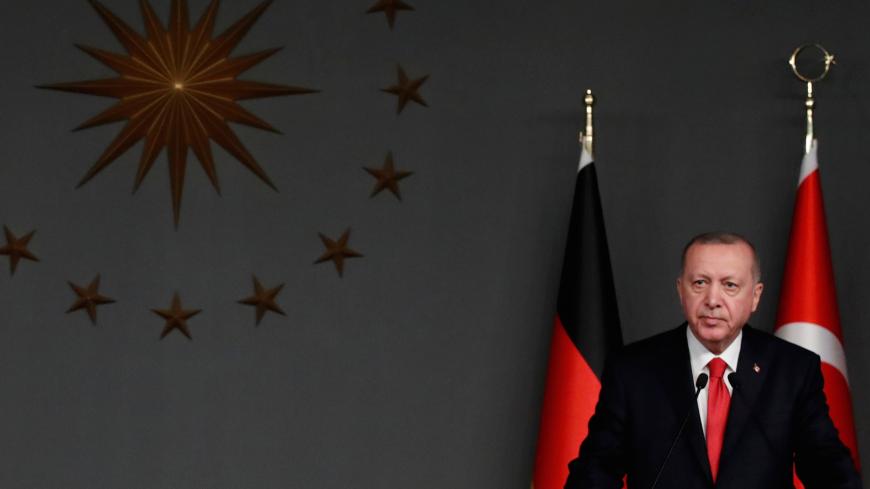 Turkish President Tayyip Erdogan and German Chancellor Angela Merkel attend a joint news conference in Istanbul, Turkey, January 24, 2020. REUTERS/Umit Bektas - RC2EME9TJL4X