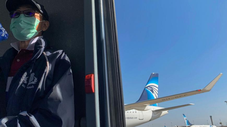 A passenger wears a protective mask at Cairo International Airport, following the outbreak of the coronavirus disease (COVID-19), in Cairo, Egypt March 10, 2020. REUTERS/Mohamed Abd El Ghany - RC2ZGF9LL3SF