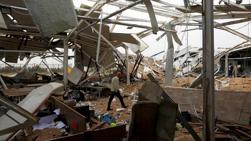 A worker checks the damages at a civilian airport under construction which, according to Iraqi religious authorities, was hit by a U.S. air strike, in the holy Shi'ite city of Kerbala, Iraq March 13, 2020. REUTERS/Alaa al-Marjani TPX IMAGES OF THE DAY - RC2ZIF9V7W4S