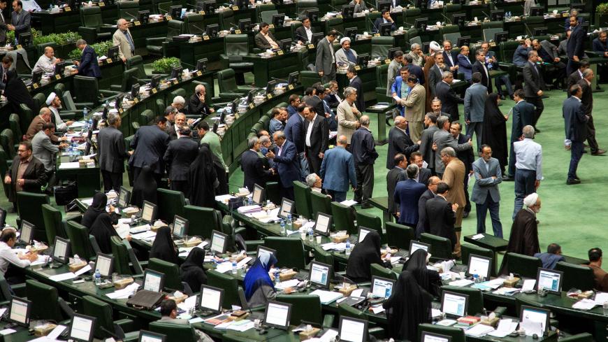 Iranian lawmakers attend a session of parliament in Tehran, Iran July 16, 2019. Nazanin Tabatabaee/WANA (West Asia News Agency) via REUTERS. ATTENTION EDITORS - THIS IMAGE HAS BEEN SUPPLIED BY A THIRD PARTY. - RC1120AED380