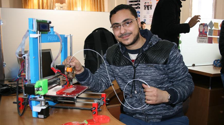 Mohammed Abu Matar sits at his desk at the Islamic University of Gaza in Gaza, Palestine, 02 February 2016. The yound man wants to produce parts with a hand-built 3D printer in order to repair larger machines - and earn money with his own company. Photo: Stefanie Jaerkel/dpa | usage worldwide   (Photo by Stefanie Järkel/picture alliance via Getty Images)