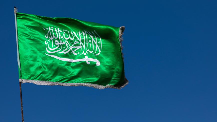 Saudi arabian flag in the wind against clear sky, Al Madinah Province, Yanbu, Saudi Arabia