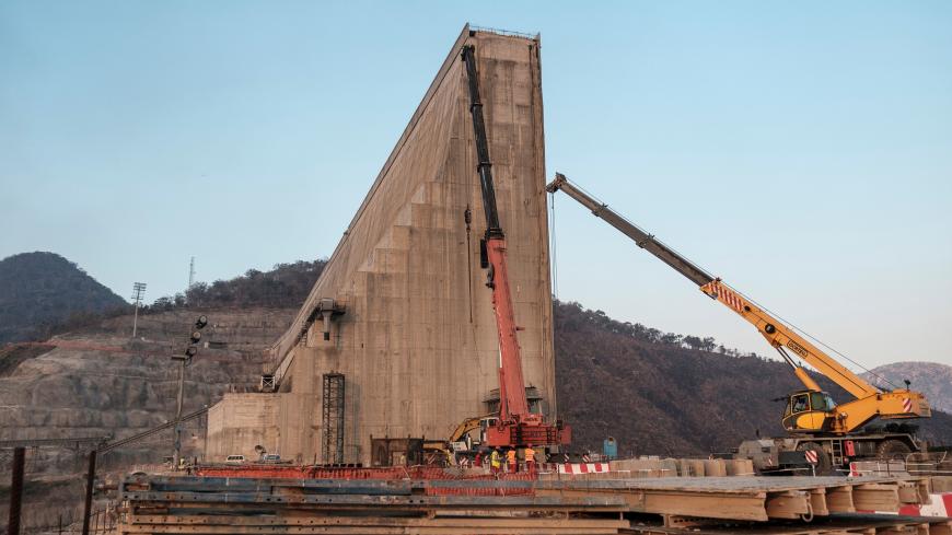 (FILES) This file photo taken on December 26, 2019 shows a general view of the construction works at the Grand Ethiopian Renaissance Dam (GERD), near Guba in Ethiopia. - The Nile, Egypt's lifeline since Pharaonic days, faces massive strain from pollution, over-use and climate change -- and now the threat of a colossal dam being built far upstream in Ethiopia. When its London-sized reservoir starts to fill this summer, Egypt fears the mega-project will spell an existential threat to its teeming population of