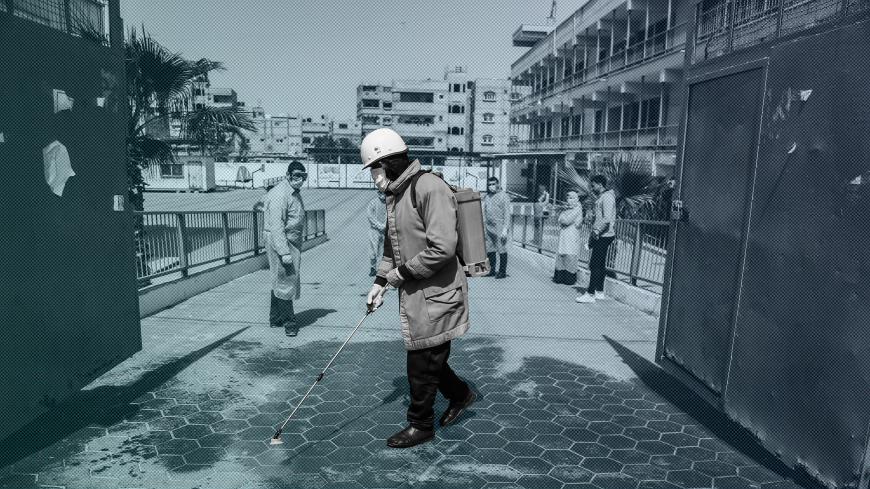 GAZA, PALESTINE - 2020/03/23: A civil worker disinfectants the UNRWA school as a preventive measure against the spread of Coronavirus in Khan Yunis.
Test results confirm two cases in Gaza hence recording the first cases of COVID-19 in the Hamas-controlled strip. (Photo by Yousef Masoud/SOPA Images/LightRocket via Getty Images)