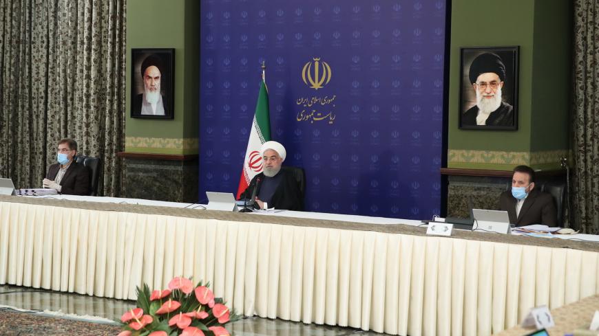 TEHRAN, IRAN - APRIL 08: (----EDITORIAL USE ONLY â MANDATORY CREDIT - "PRESIDENCY OF IRAN / HANDOUT" - NO MARKETING NO ADVERTISING CAMPAIGNS - DISTRIBUTED AS A SERVICE TO CLIENTS----) Iranian President Hassan Rouhani (C) speaks during the National Committee Against the Coronavirus (COVID-19), in Tehran, Iran on April 08, 2020. (Photo by Iranian Presidency / Handout/Anadolu Agency via Getty Images)