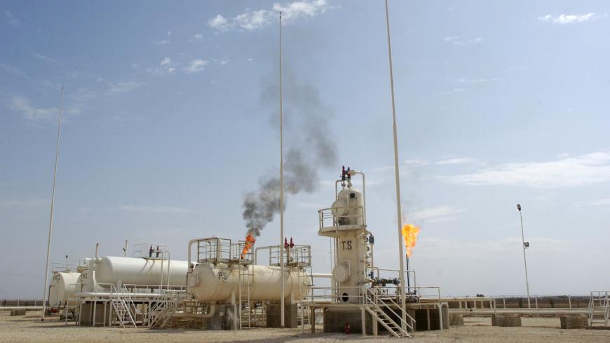 A flame rises from a chimney at Al-Jbessa oil field in Al-Shaddadeh town of Al-Hasakah governorate October 14, 2010.   REUTERS/Stringer (SYRIA - Tags: ENERGY BUSINESS) - GF2EA9B0TI601