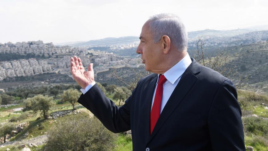 Israeli Prime Minister Benjamin Netanyahu delivers a statement overlooking the Israeli settlement of Har Homa, located in an area of the Israeli-occupied West Bank, that Israel annexed to Jerusalem after the region's capture in the 1967 Middle East war, February 20, 2020. Debbie Hill/Pool via REUTERS - RC2E4F9ALPB6