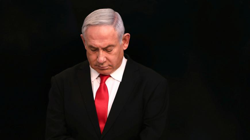 Israeli Prime Minister Benjamin Netanyahu arrives for a speech at his Jerusalem office, regarding the new measures that will be taken to fight the coronavirus, March 14, 2020. Gali Tibbon/Pool via REUTERS - RC2WJF9D9S2R