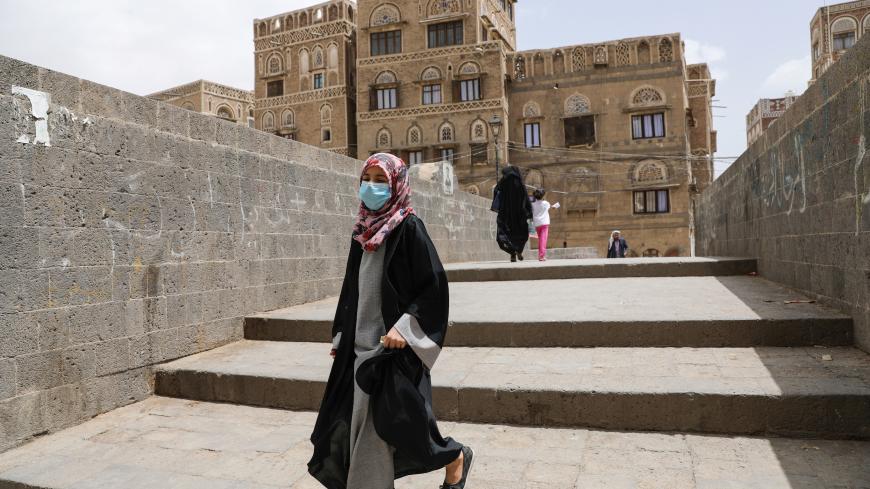 A girl wears a protective face mask amid fears of the spread of the coronavirus disease (COVID-19) in Sanaa, Yemen March 17, 2020. REUTERS/Khaled Abdullah - RC2GMF9MKBUS