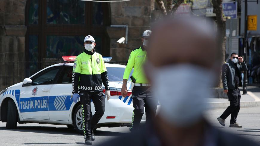 Traffic police officers wearing face masks patrol as the spread of coronavirus disease (COVID-19) continues, in Diyarbakir, Turkey, April 9, 2020. REUTERS/Sertac Kayar - RC261G9NDY2G