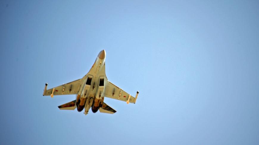 A Russian Sukhoi Su-35 fighter takes off at the Russian military base of Hmeimim, located south-east of the city of Latakia in Hmeimim, Latakia Governorate, Syria, on September 26, 2019. - With military backing from Russia, President Bashar al-Assad's forces have retaken large parts of Syria from rebels and jihadists since 2015, and now control around 60 percent of the country. Russia often refers to troops it deployed in Syria as military advisers even though its forces and warplanes are also directly invo
