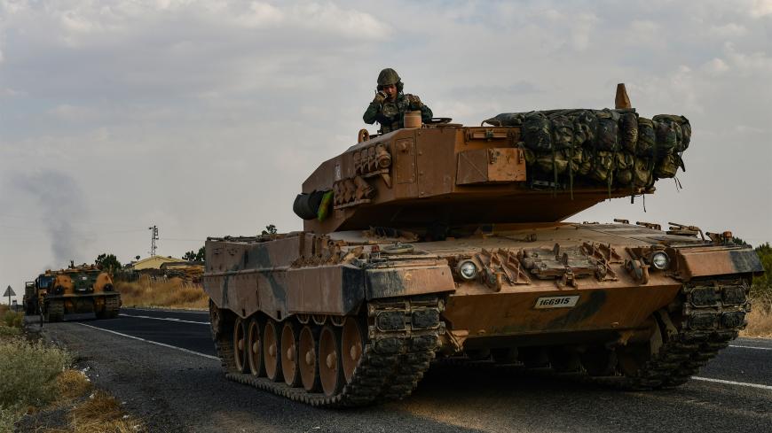 CEYLANPINAR, TURKEY - OCTOBER 18: A Turkish army tank moves towards the Syrian border on October 18, 2019 in Ceylanpinar, Turkey. Turkish forces appeared to continue shelling targets in Northern Syria despite yesterday's announcement, by U.S. Vice President Mike Pence, that Turkey had agreed to a ceasefire in its assault on Kurdish-held towns near its border. (Photo by Burak Kara/Getty Images)