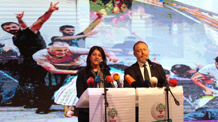 Co-leaders of pro-Kurdish Peoples' Democratic Party (HDP) Pervin Buldan (L) and Sezai Temelli speak on stage during a meeting in Ankara, on November 20, 2019 - Turkey's main pro-Kurdish Peoples' Democratic Party (HDP) will discuss in Ankara a possible withdrawal from parliament in response to the crackdown against it. In recent weeks, several mayors in the southeast have been sacked or detained. (Photo by Adem ALTAN / AFP) (Photo by ADEM ALTAN/AFP via Getty Images)