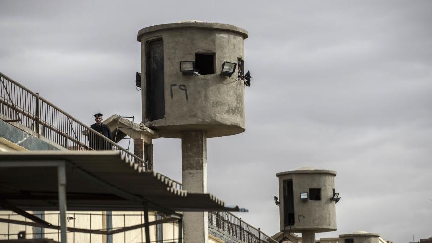 A picture taken during a guided tour organised by Egypt's State Information Service on February 11, 2020, shows an Egyptian policeman near watch towers at Tora prison in the Egyptian capital Cairo. (Photo by Khaled DESOUKI / AFP) (Photo by KHALED DESOUKI/AFP via Getty Images)