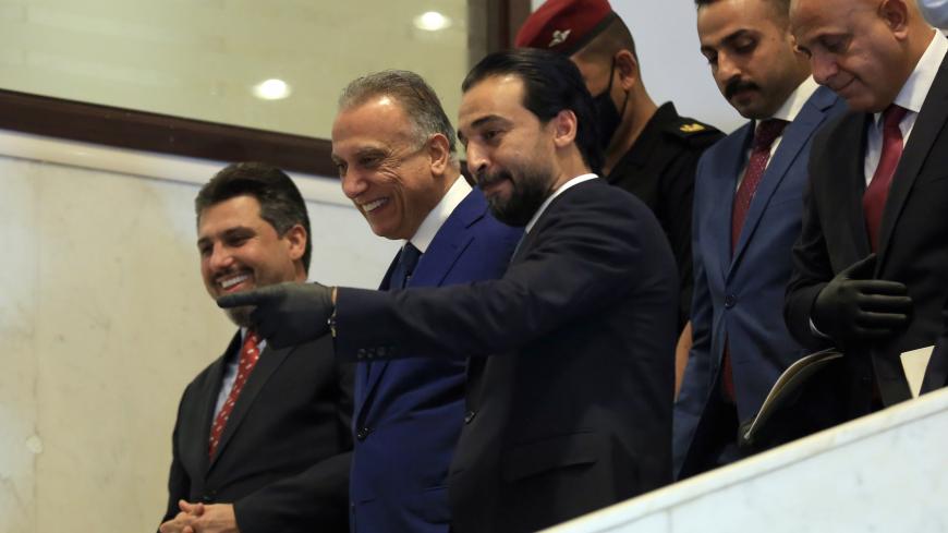 BAGHDAD, IRAQ - MAY 06: The speaker of the Council of Representatives of Iraq, Mohamed Al-Halbousi (right 3) welcomes Iraqi PM-designate Mustafa al-Kadhimi after the PM received vote of confidence at the parliament in Baghdad, Iraq on May 06, 2020.  Only 15 out of 22 ministers from cabinet of Prime Minister-designate Mustafa al-Kadhimi receive vote of confidence from Iraq√¢s parliament. (Photo by Murtadha Al-Sudani/Anadolu Agency via Getty Images)