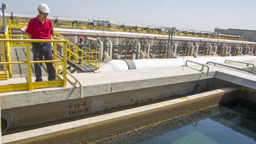 SOREK, ISRAEL - May 20: Hertzel, a security guard at the IDE Technologies Sorek Project Desalination Plant, looks out over the water treatment facilities on May 20, 2015 in Sorek, Israel. The plant, commissioned in 2013, uses reverse osmosis technology to process sea water,  providing 20% of Israel's domestic water consumption. Photo by Ann Hermes/The Christian Science Monitor
