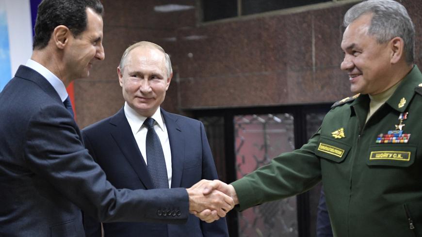 Russian President Vladimir Putin, Defence Minister Sergei Shoigu and Syrian President Bashar al-Assad attend a meeting in Damascus, Syria January 7, 2020. Picture taken January 7, 2020. Sputnik/Aleksey Nikolskyi/Kremlin via REUTERS  ATTENTION EDITORS - THIS IMAGE WAS PROVIDED BY A THIRD PARTY. - RC2IBE9TXXCM