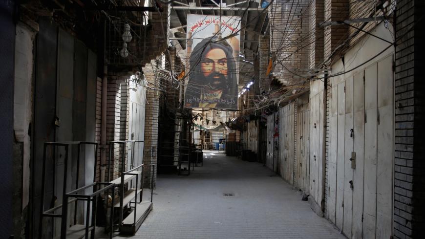 Closed shops are seen during a curfew imposed to prevent the spread of coronavirus disease (COVID-19), in Baghdad, Iraq May 31, 2020. REUTERS/Khalid al-Mousily - RC2QZG9QKZIO