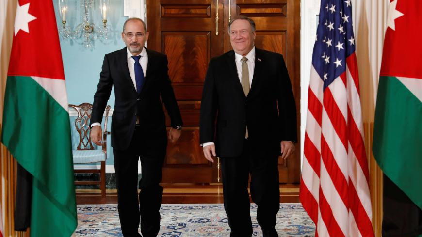 U.S. Secretary of State Mike Pompeo meets with Jordanian Foreign Minister Ayman Safadi during a gathering of foreign ministers aligned toward the defeat of Islamic State at the State Department in Washington, U.S., February 6, 2019. REUTERS/Kevin Lamarque - RC1400997050